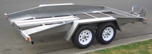 Open, tandem-axle, tag car hauler